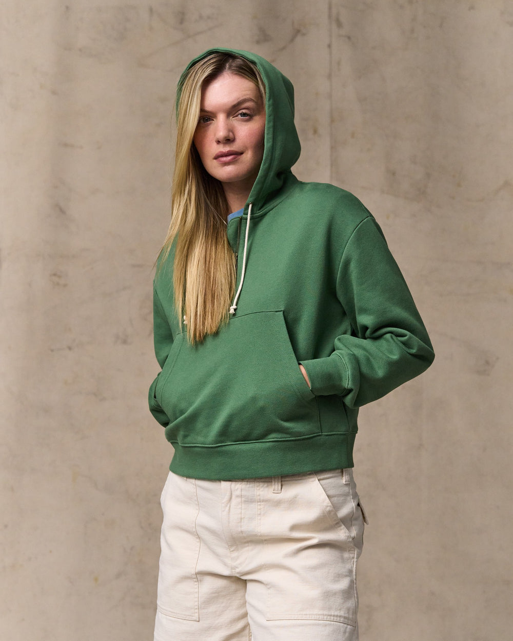 image of a model wearing Filson's Women's French Terry Half-zip Hoodie - Light Forest