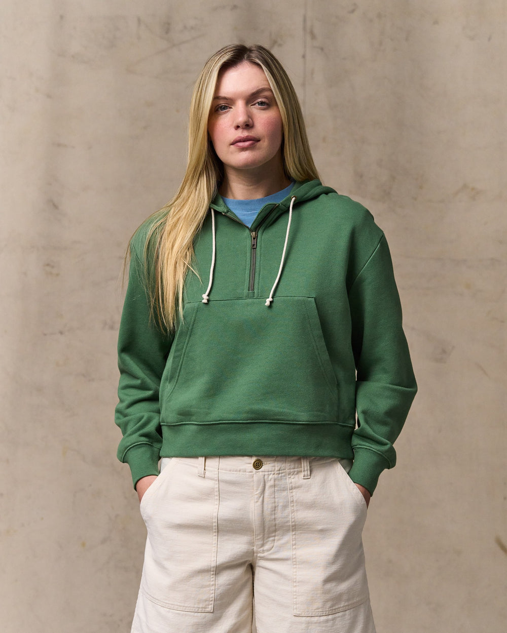 image of a model wearing Filson's Women's French Terry Half-zip Hoodie - Light Forest
