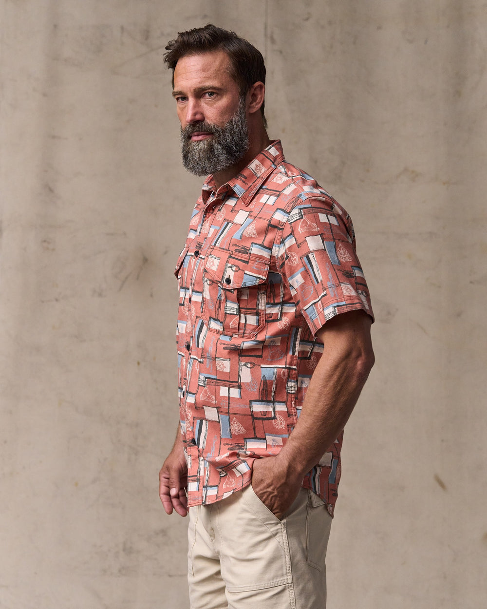 image of a model wearing Filson's Short Sleeve Lightweight Alaskan Guide Shirt  - Russet / Print