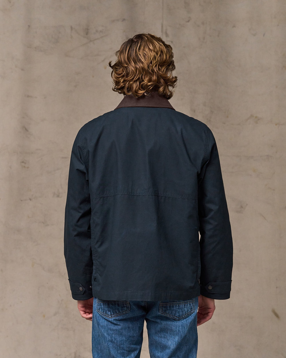 image of a model wearing Filson's Dry Wax Short Field Jacket - Navy