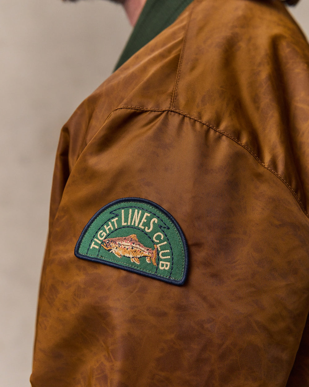 image of a model wearing Filson's Embroidered Montlake Jacket - Whiskey