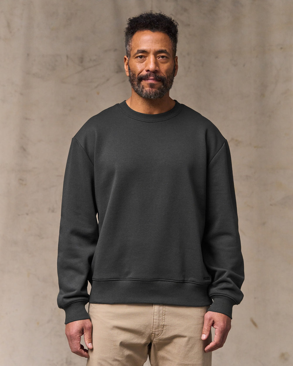 image of a model wearing Filson's Northwest Crewneck Sweatshirt - Faded Black