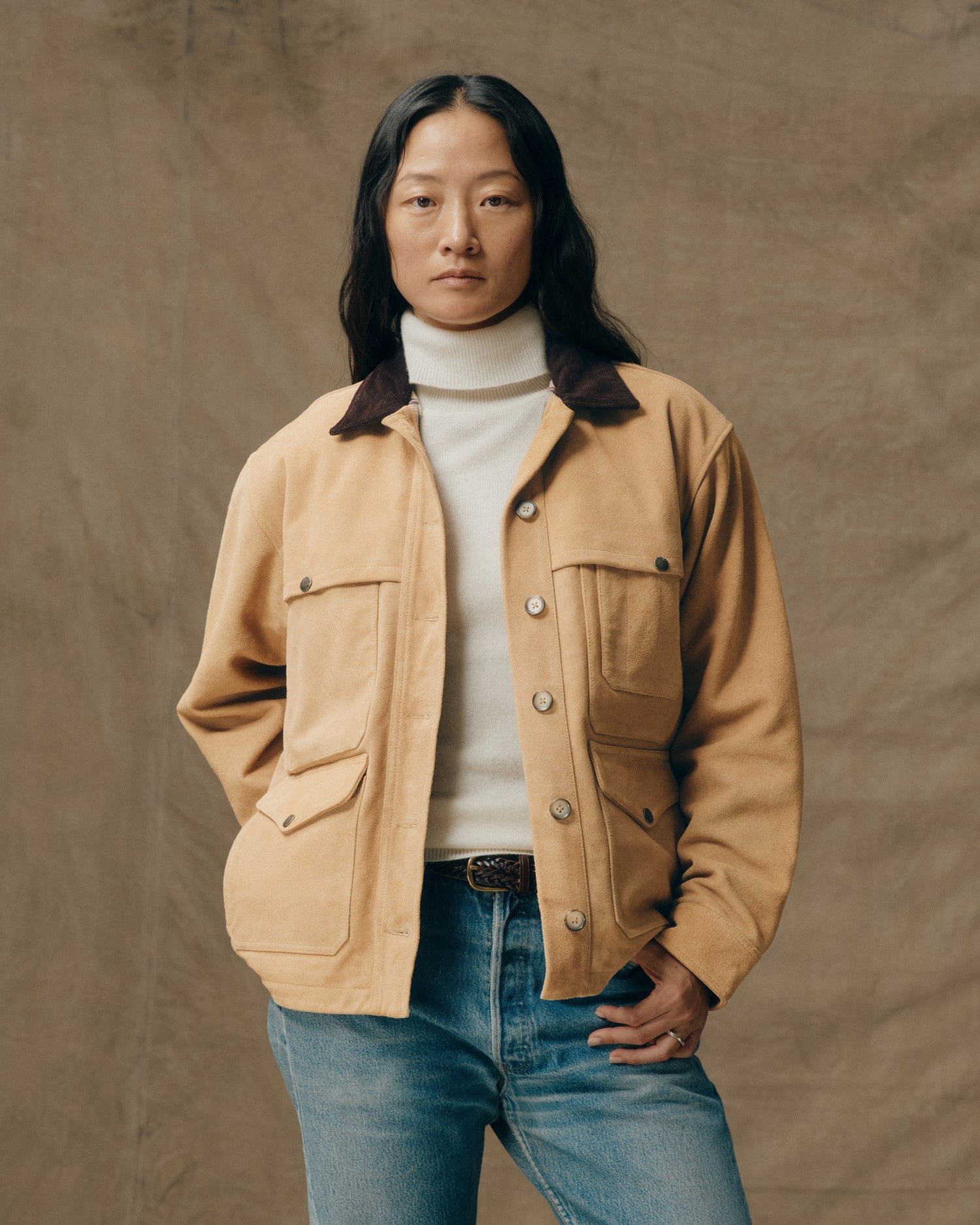 image of a model wearing Filson's Women's Suede Leather Cruiser - Tan|Model is 5'8" wearing a size medium