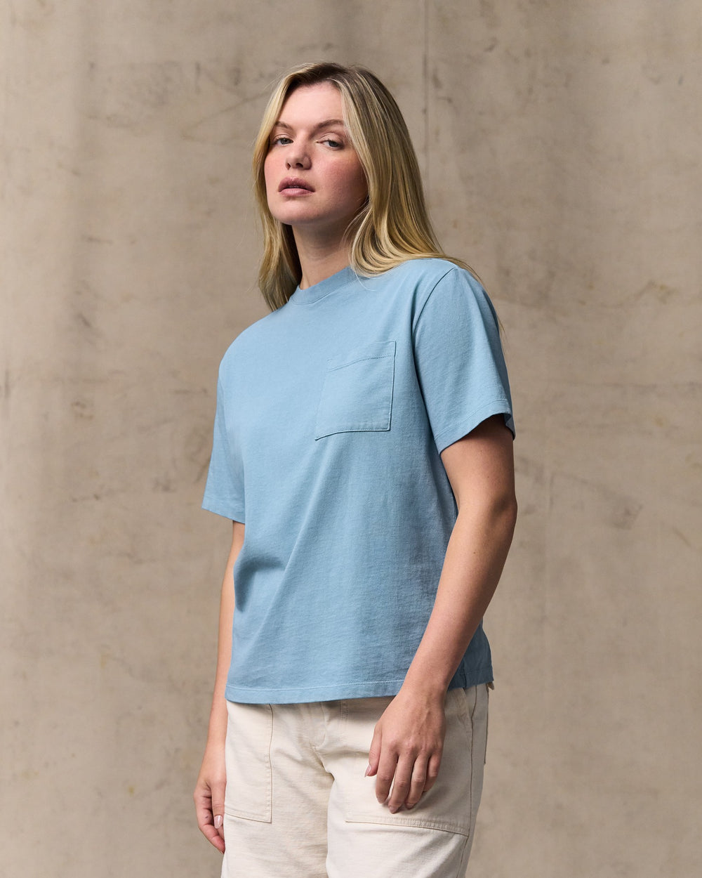 image of a model wearing Filson's Women's Short Sleeve Pocket Tee - Light Blue