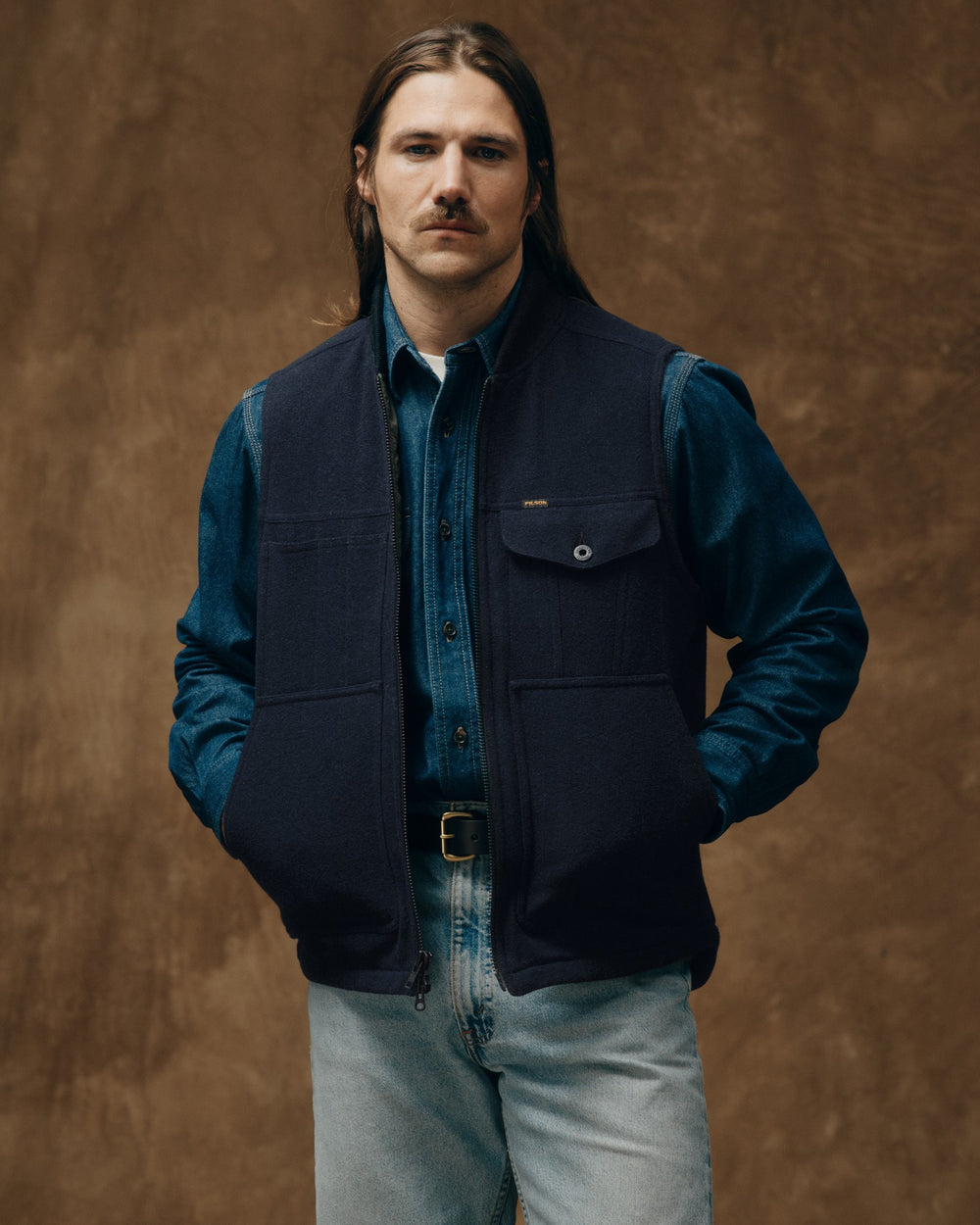 image of a model wearing Filson's Spokane Insulated Work Vest - Navy