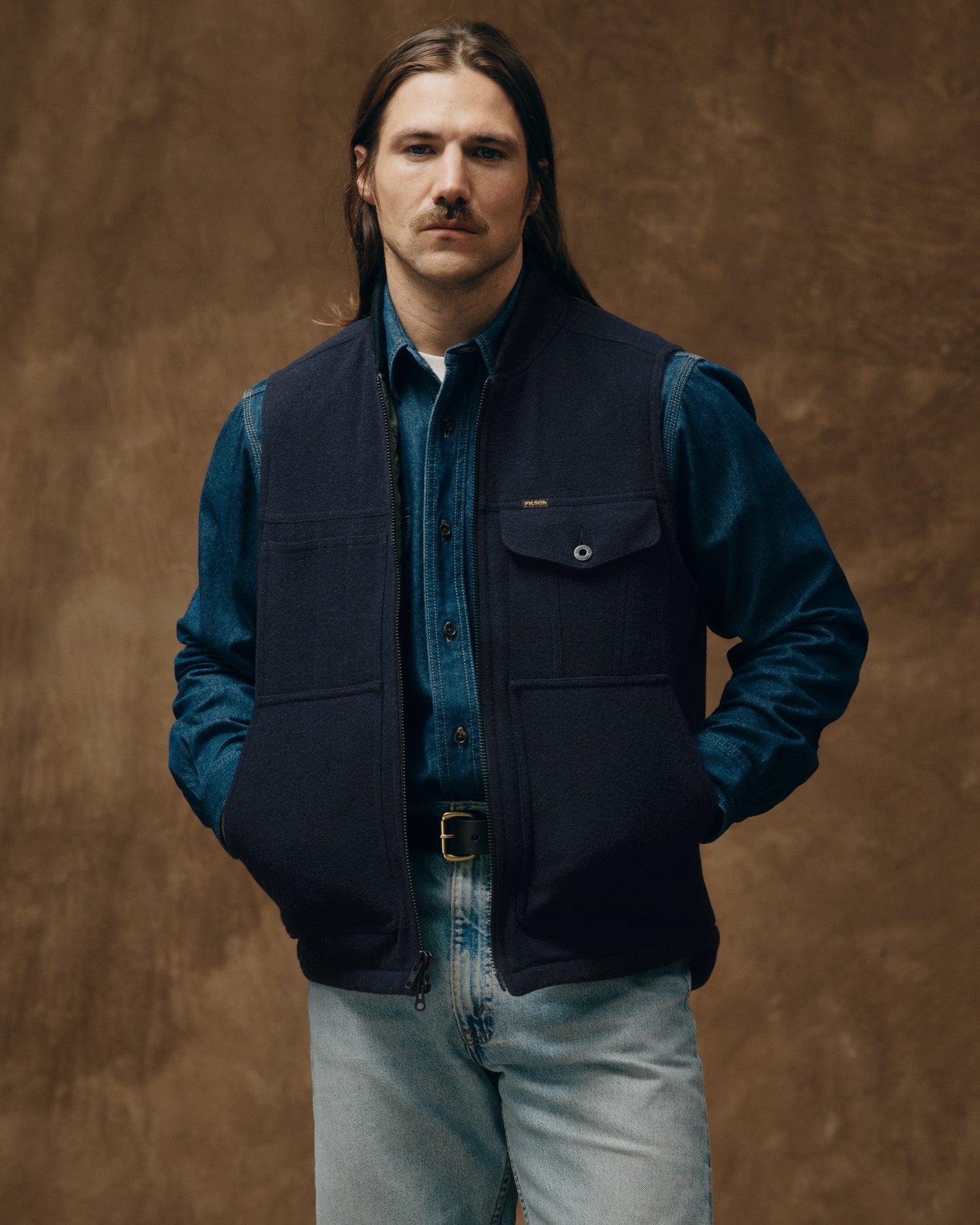 image of a model wearing Filson's Spokane Insulated Work Vest - Navy|Model is 5'10" wearing a size medium