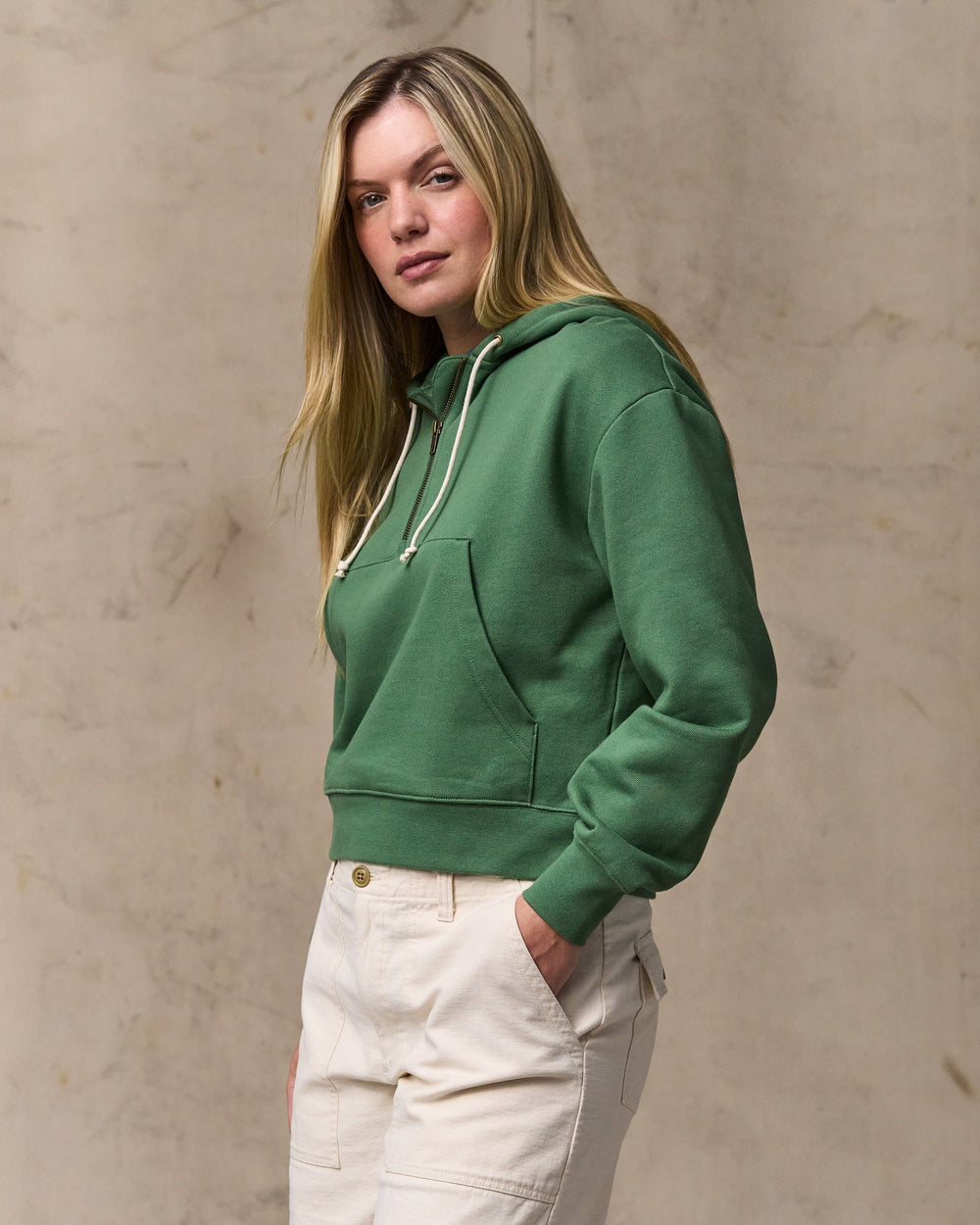 image of a model wearing Filson's Women's French Terry Half-zip Hoodie - Light Forest