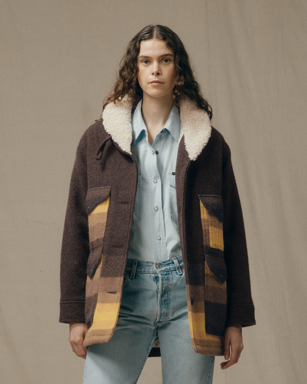 image of a model wearing Filson's Women's Kodiak Shawl Collar Coat - Brown / Yellow Stripe