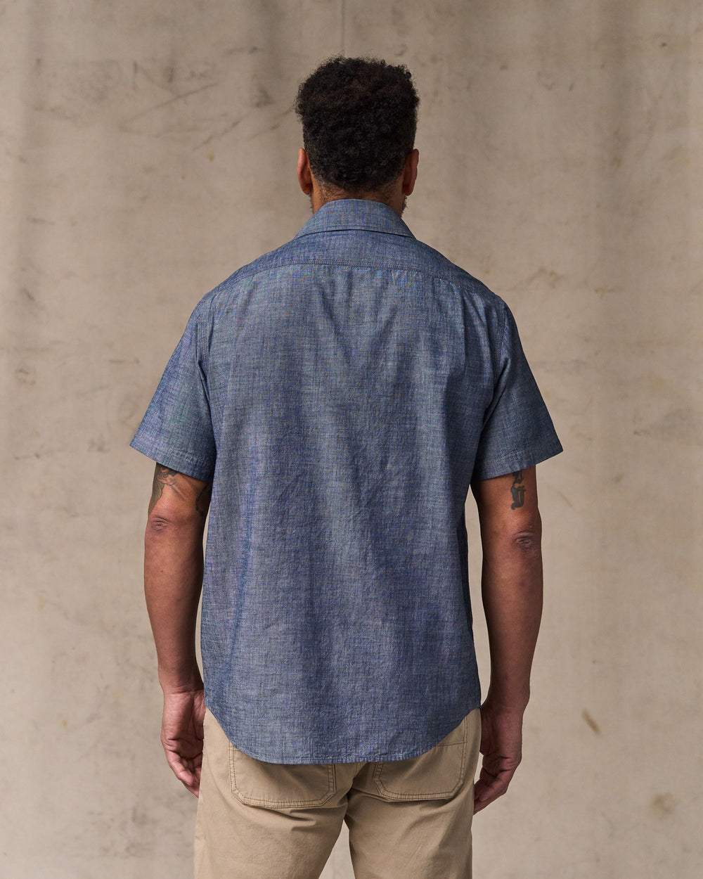 image of a model wearing Filson's Short Sleeve Chambray Shirt  - Vintage Fade