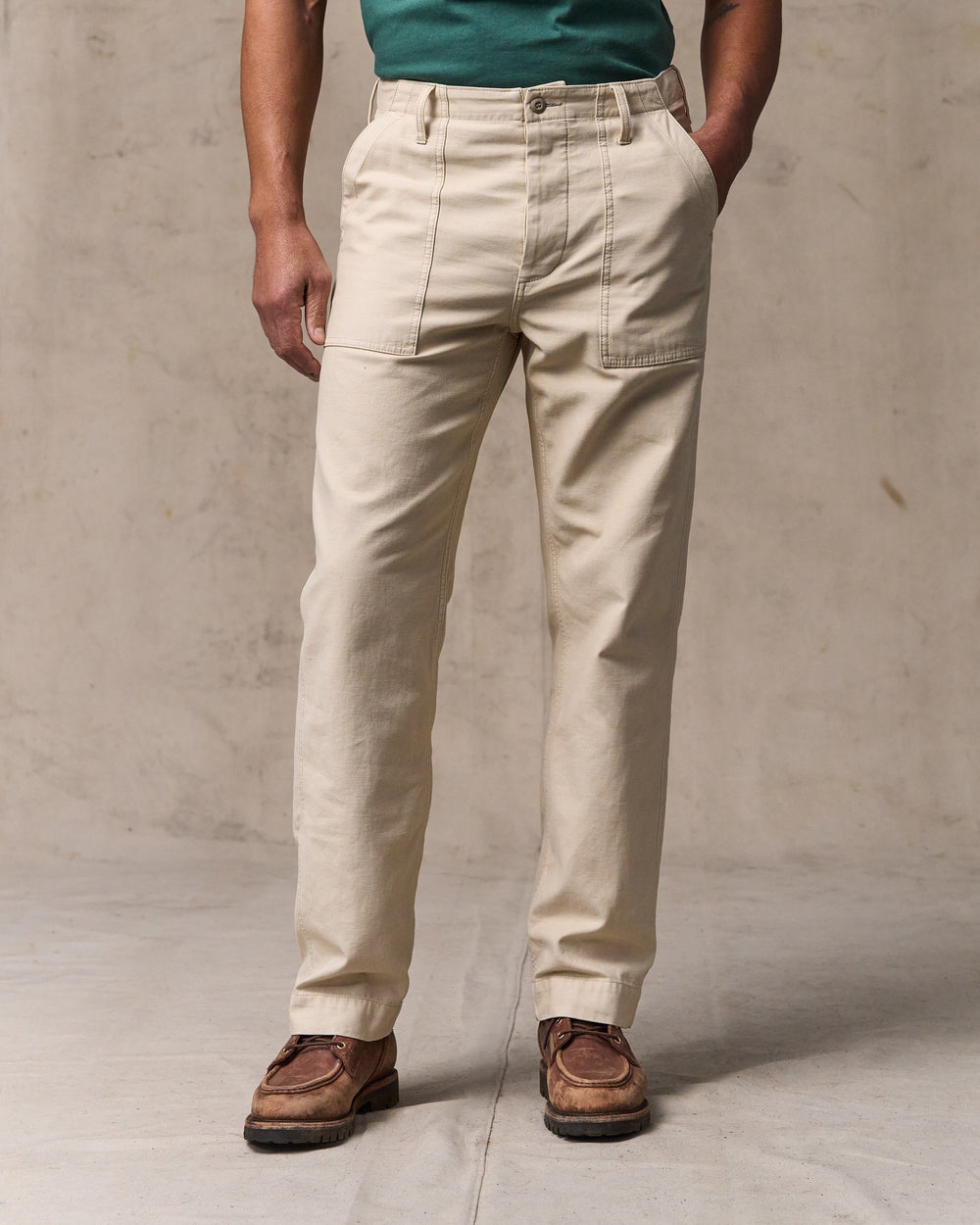 image of a model wearing Filson's Field Supply Pants - Washed Oatmeal