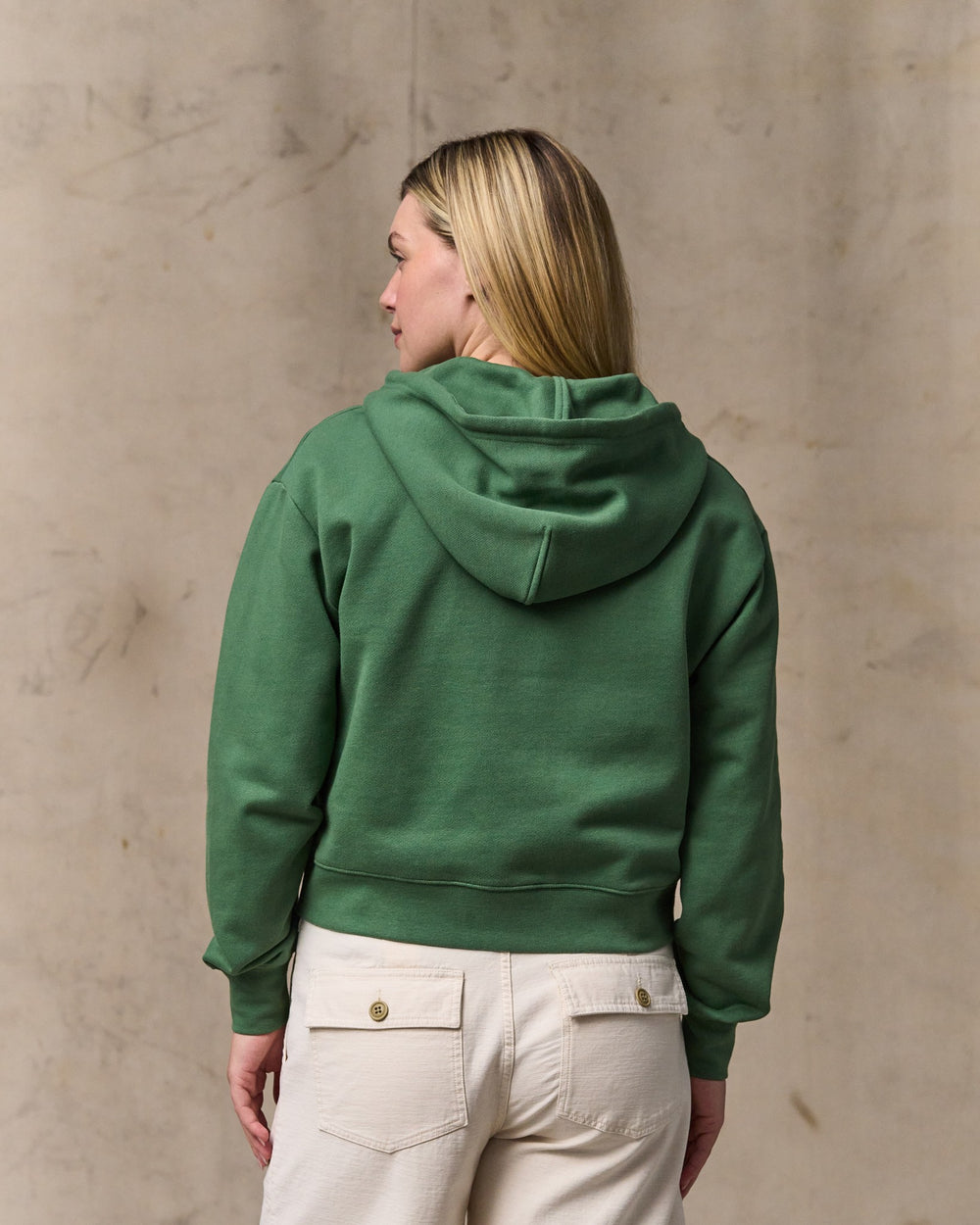 image of a model wearing Filson's Women's French Terry Half-zip Hoodie - Light Forest