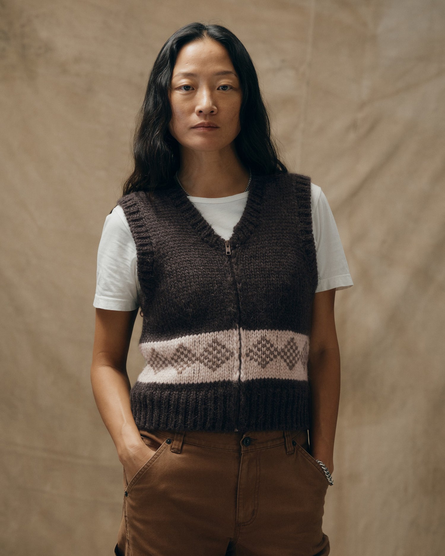 image of a model wearing Filson's Women's Wool Vest - Dark Brown|Model is 5'8" wearing a size medium