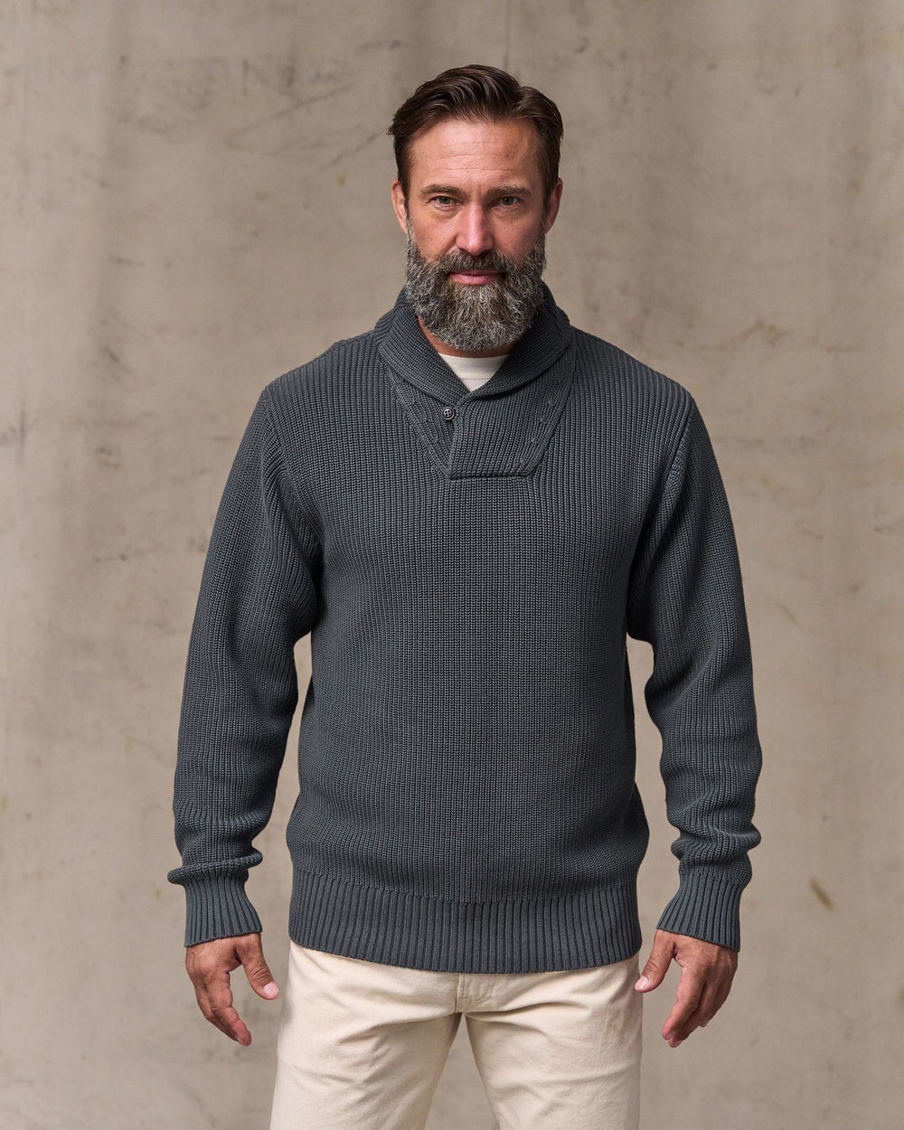 image of a model wearing Filson's Vintage Cotton Shawl Neck Sweater - Charcoal