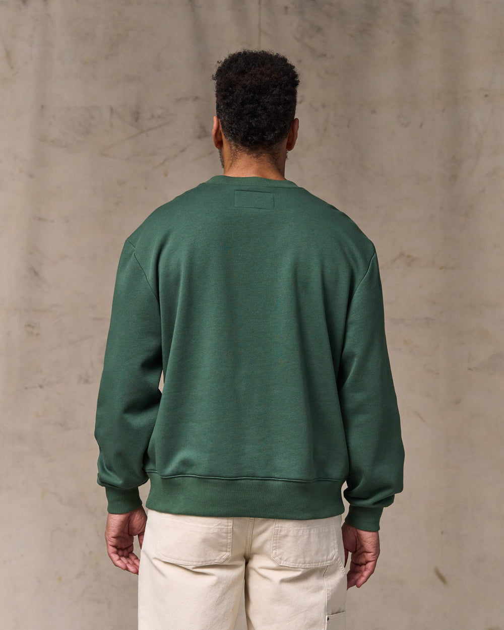 image of a model wearing Filson's Northwest Crewneck Sweatshirt - Granite Green