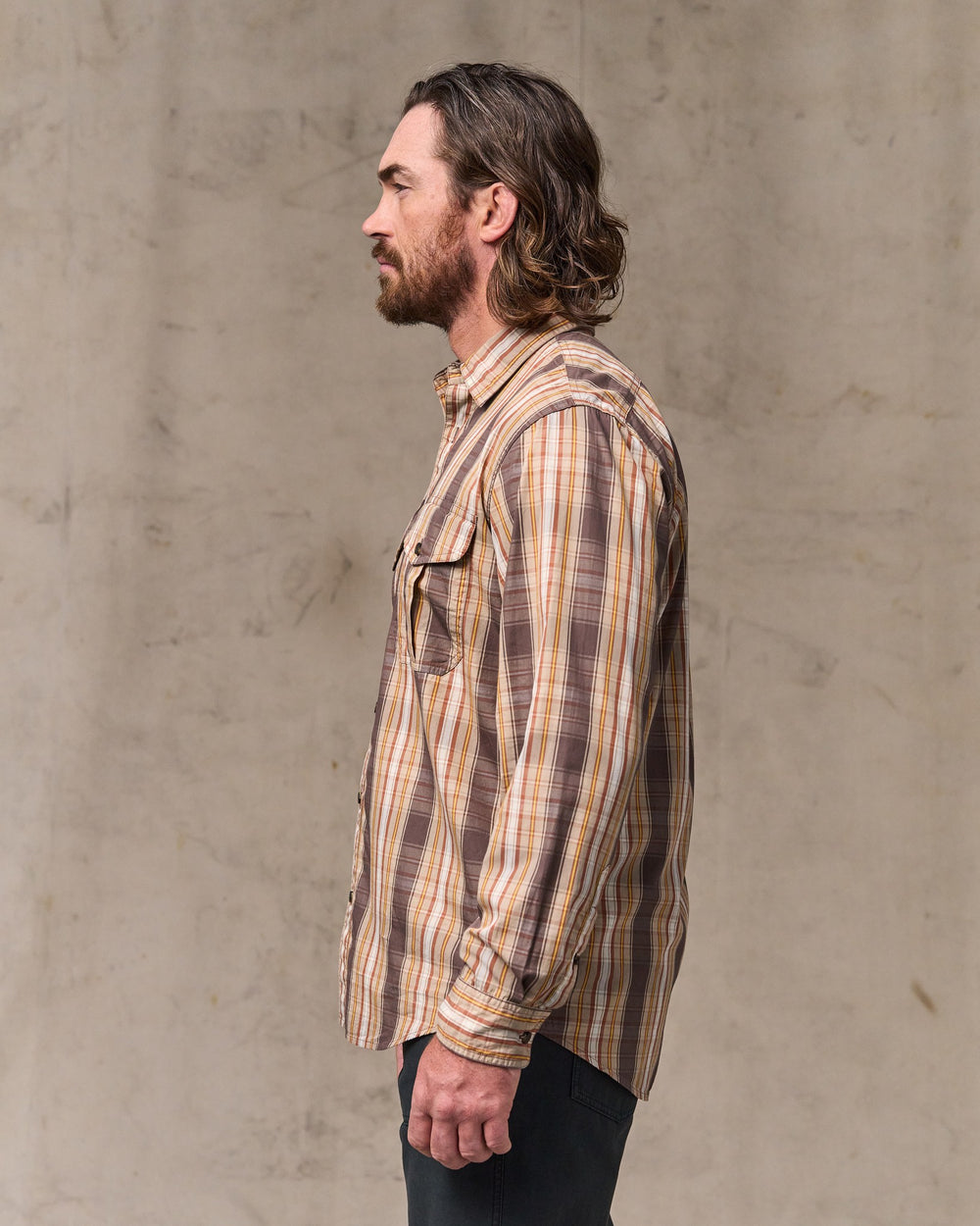 image of a model wearing Filson's Filson's Washed Feather Cloth Shirt - Brown Multi Plaid
