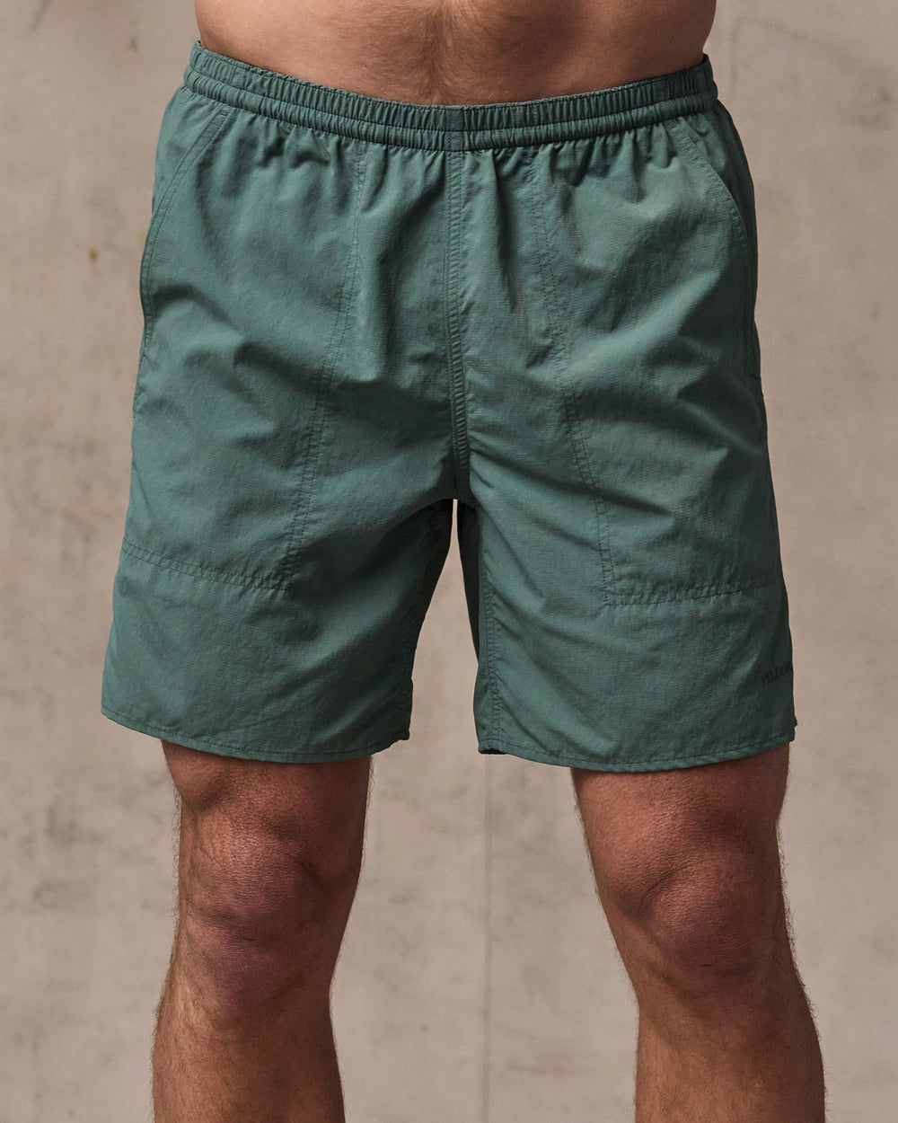 image of a model wearing Filson's Oxbow Lake Trunks - Dark Forest