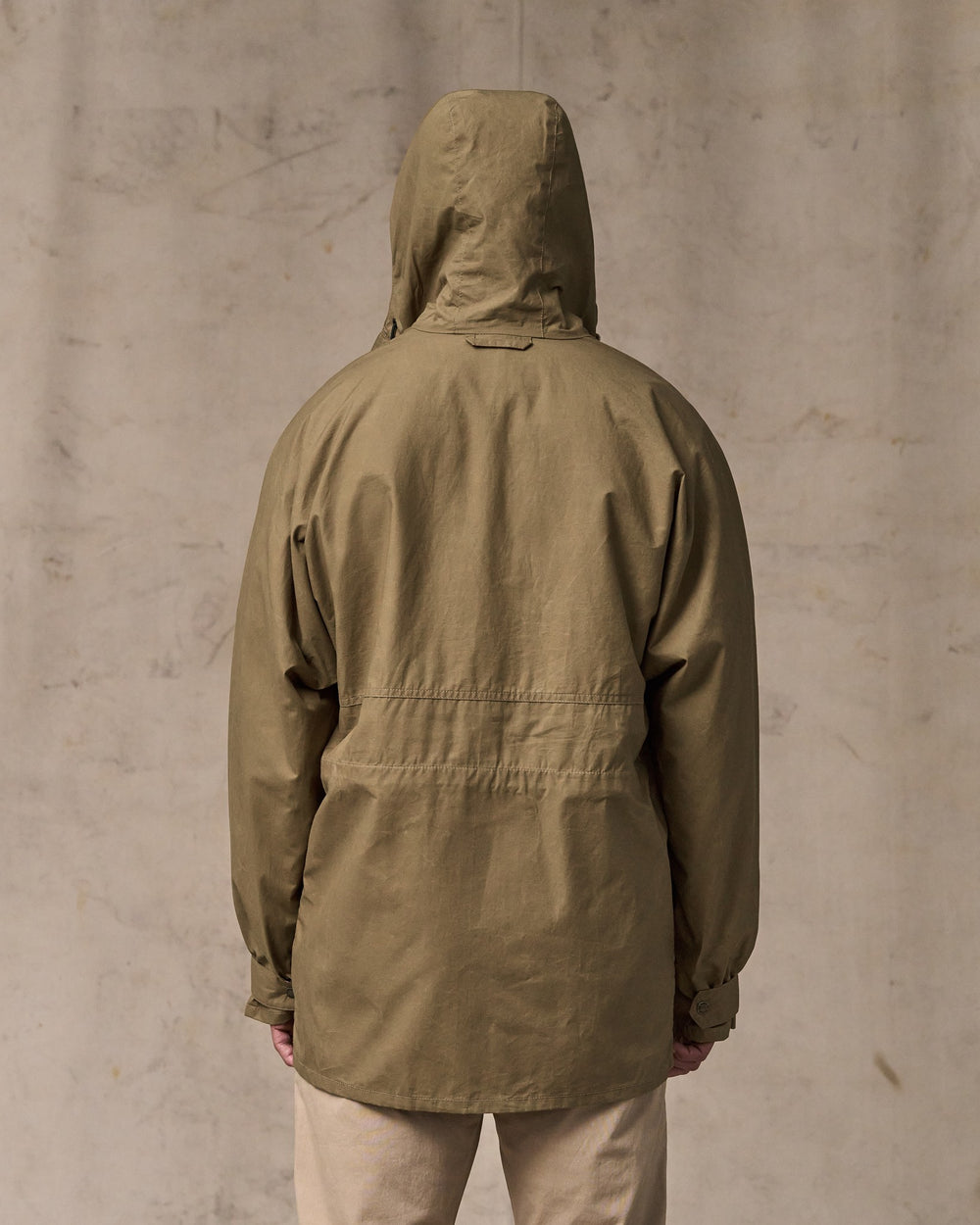 image of a model wearing Filson's Dry Wax Omak Coat - Dark Beige