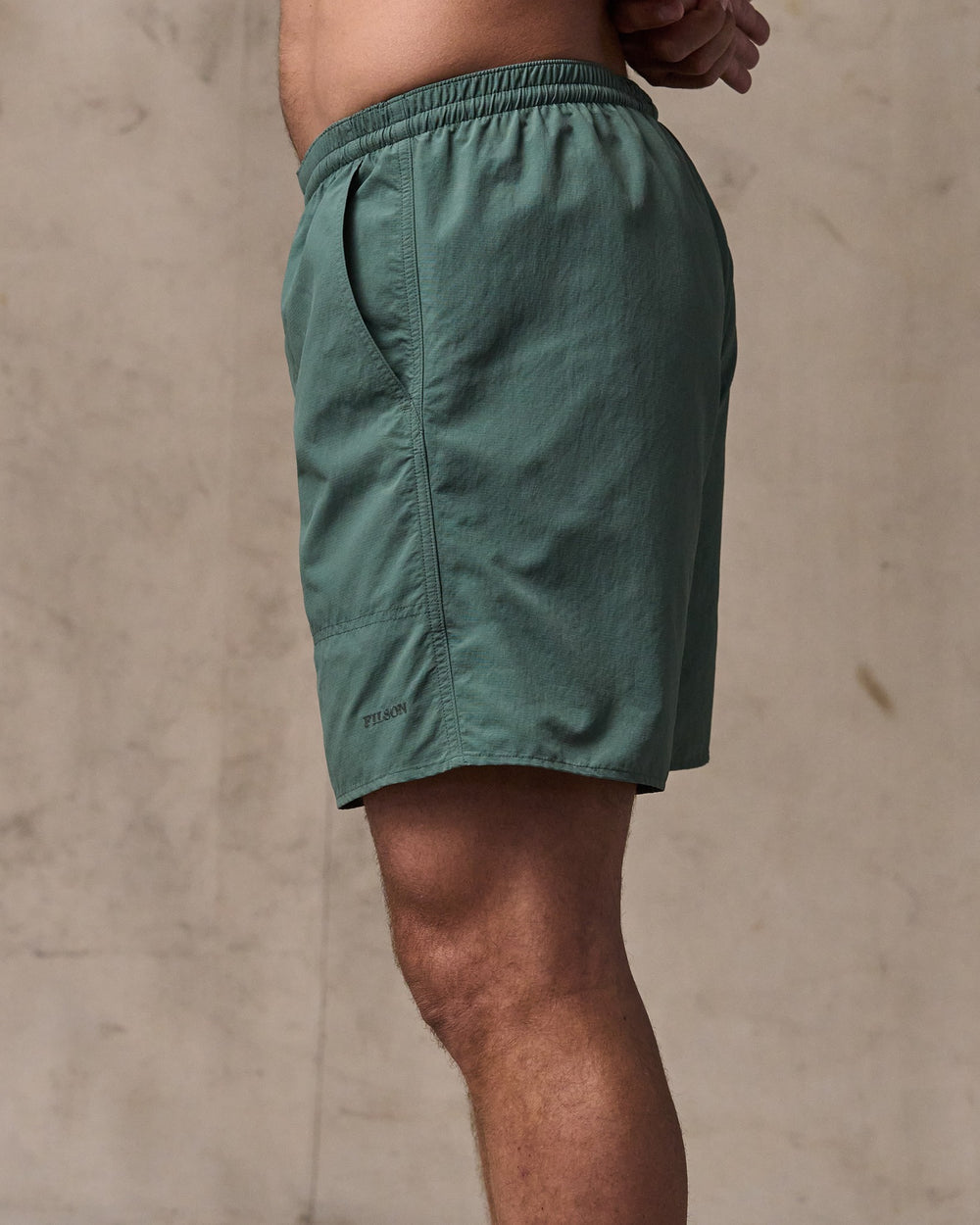 image of a model wearing Filson's Oxbow Lake Trunks - Dark Forest