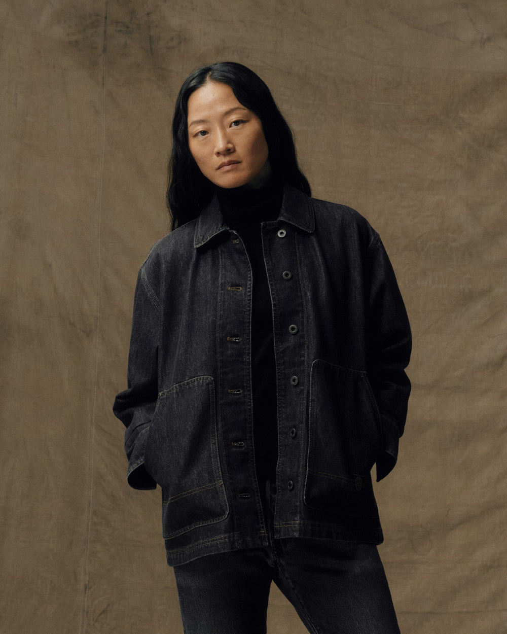 image of a model wearing Filson's Women's Denim Barn Coat - Rinse Black