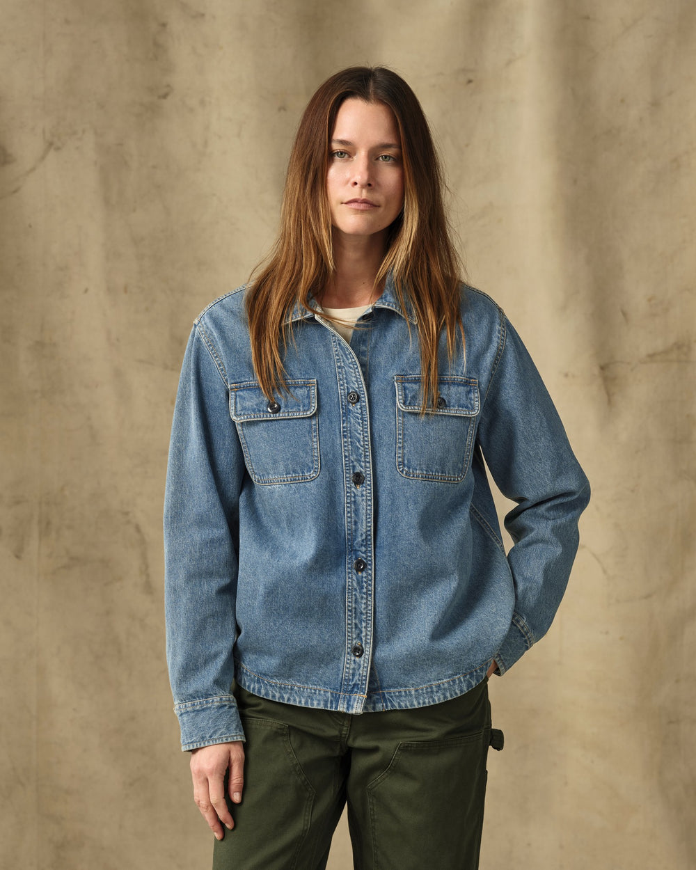 image of a model wearing Filson's Women's Embroidered Denim Shirt - Vintage Indigo