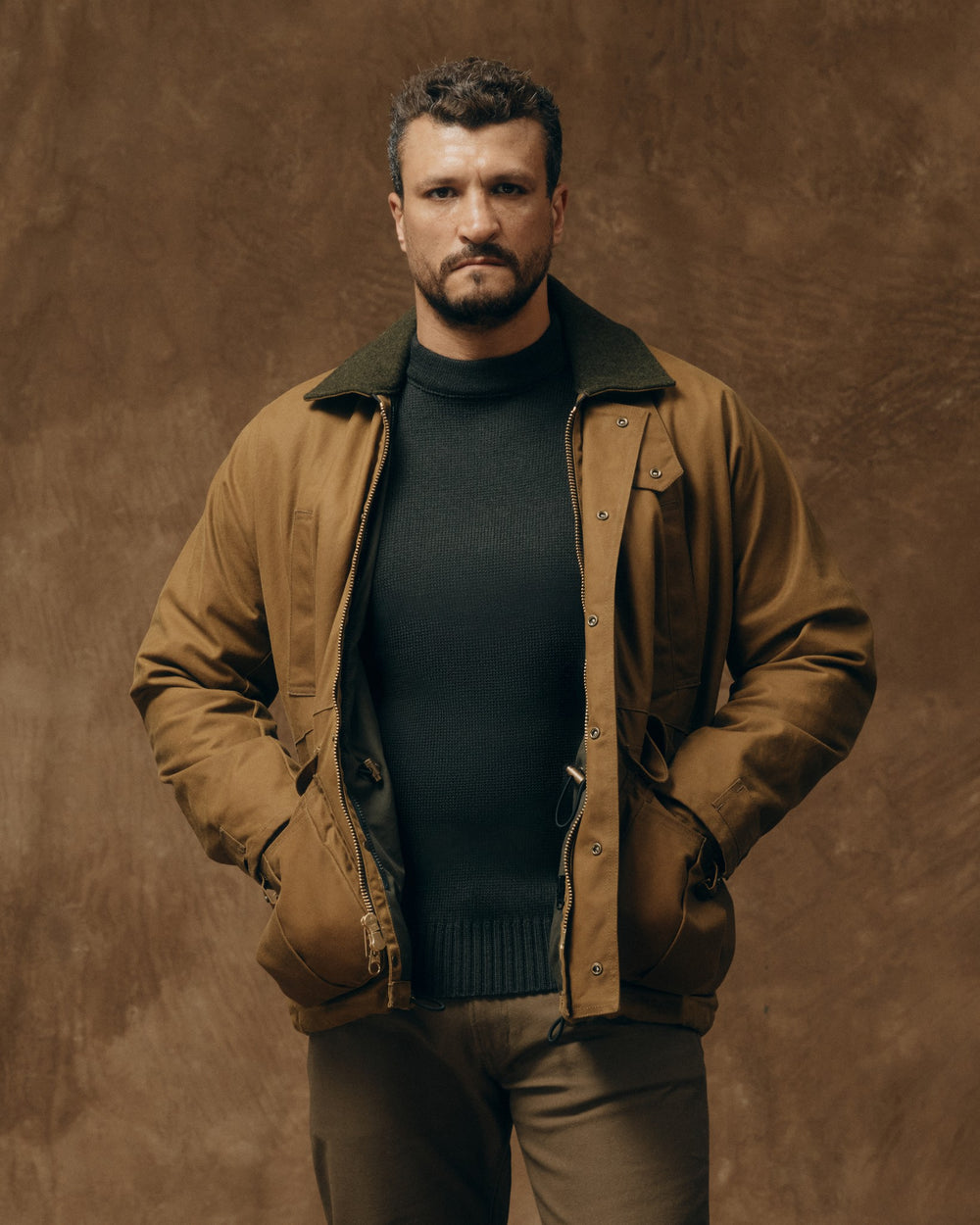 image of a model wearing Filson's Lined Tin Cloth Field Jacket - Dark Tan