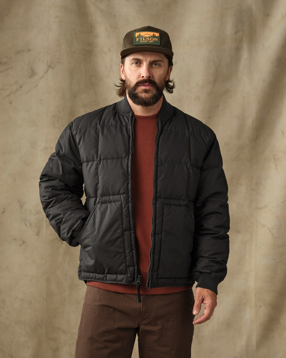 image of a model wearing Filson's Heritage Cotton Down Jacket - Black