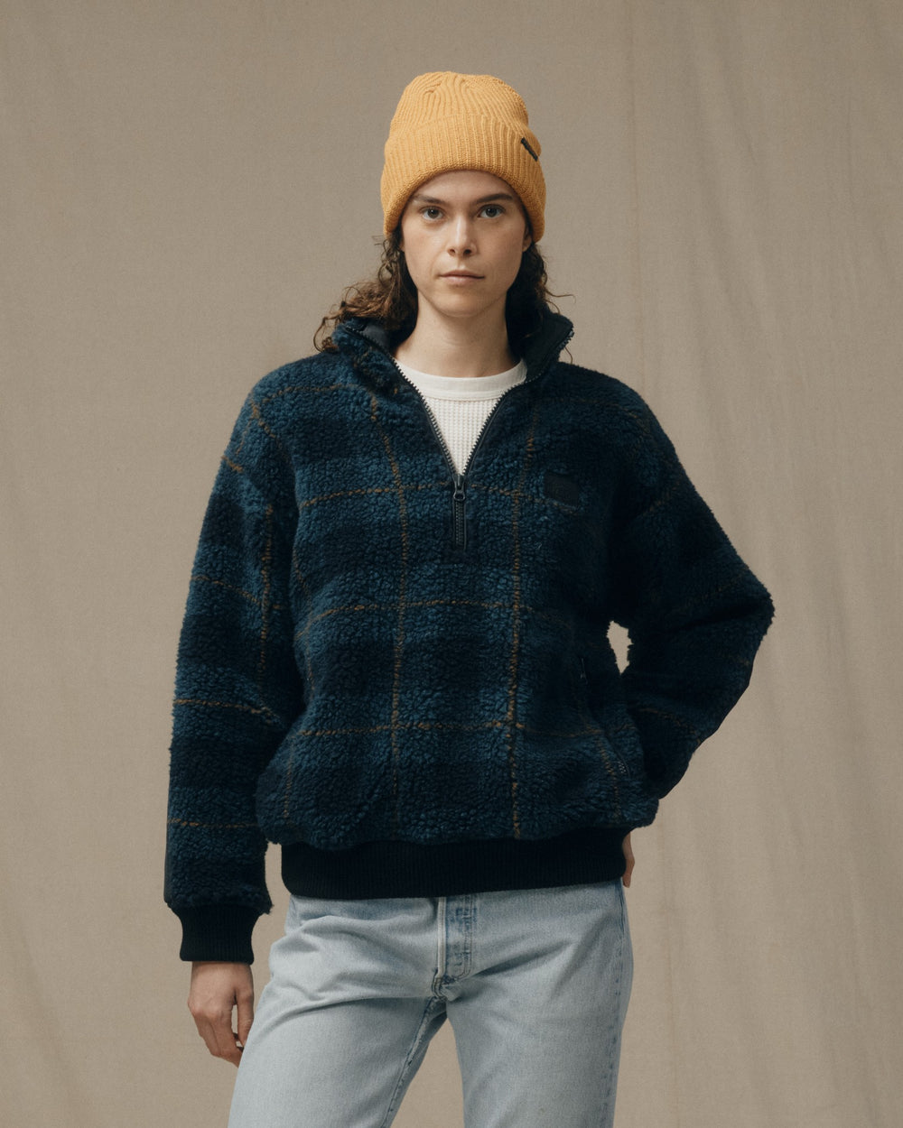 image of a model wearing Filson's Women's Pile Fleece Popover - Blue / Black Plaid