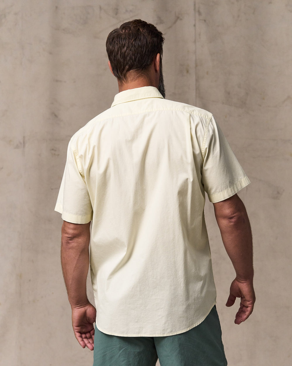 image of a model wearing Filson's Filson's Washed Short Sleeve Feather Cloth Shirt - Ivory