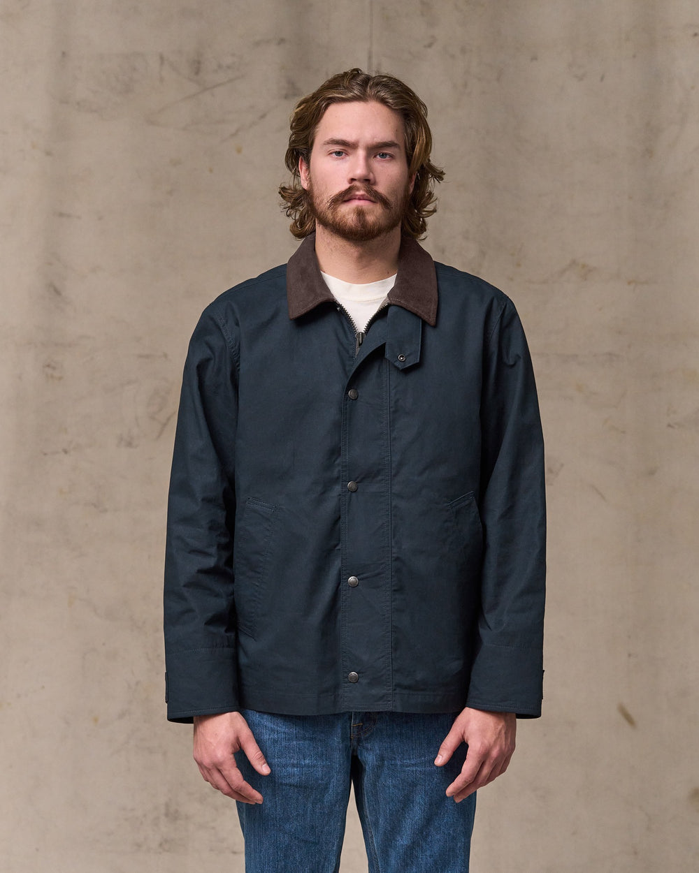 image of a model wearing Filson's Dry Wax Short Field Jacket - Navy