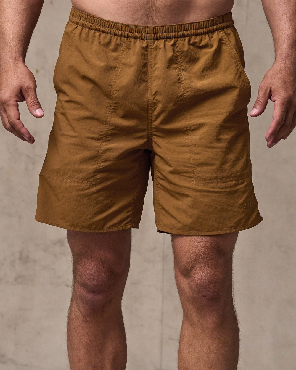 image of a model wearing Filson's Oxbow Lake Trunks - Whiskey