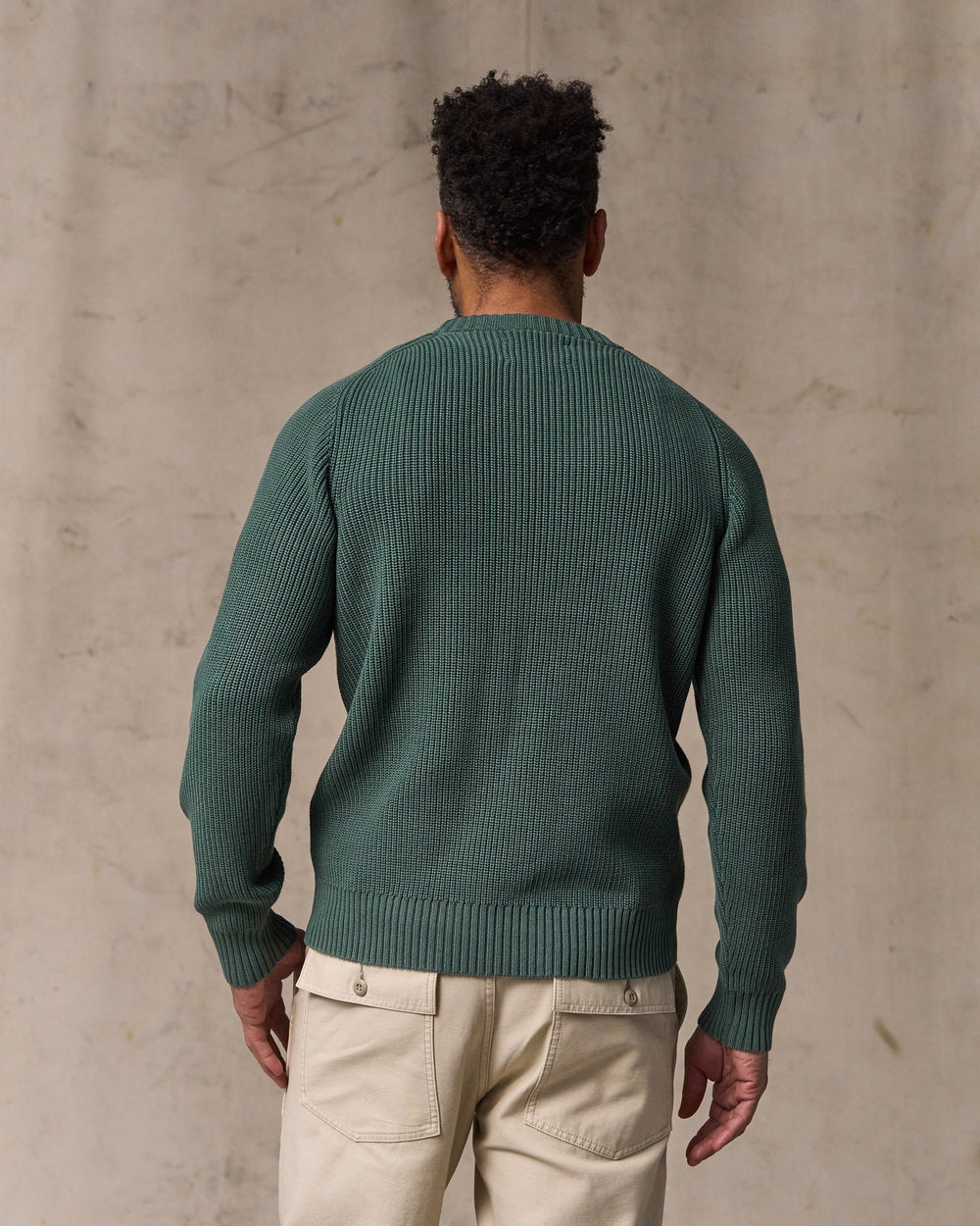 image of a model wearing Filson's Vintage Cotton Crewneck Sweater - Juniper