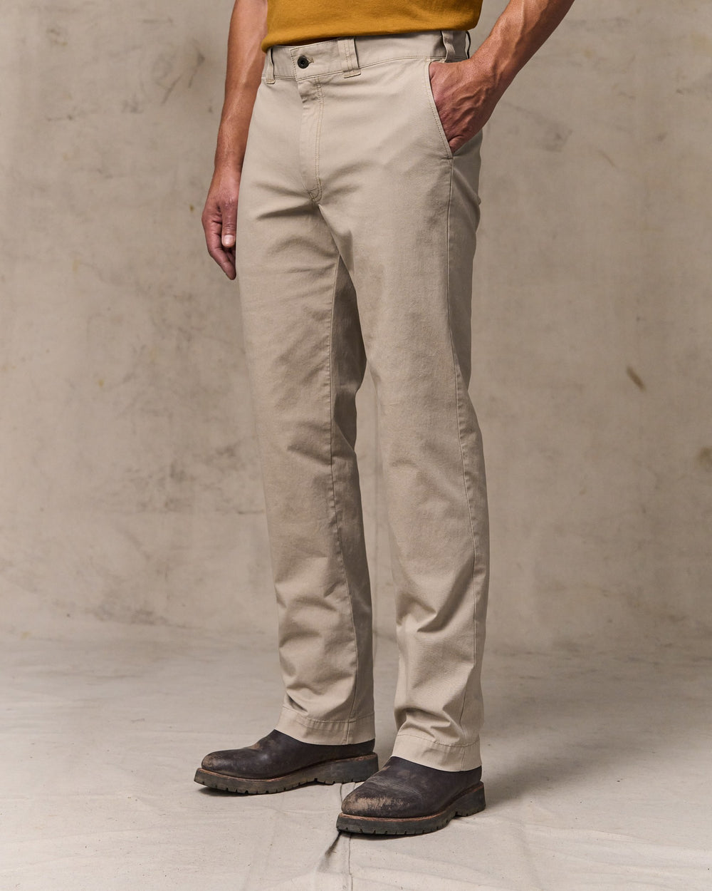 image of a model wearing Filson's Granite Mountain Flat Front Pants - Buck Tan