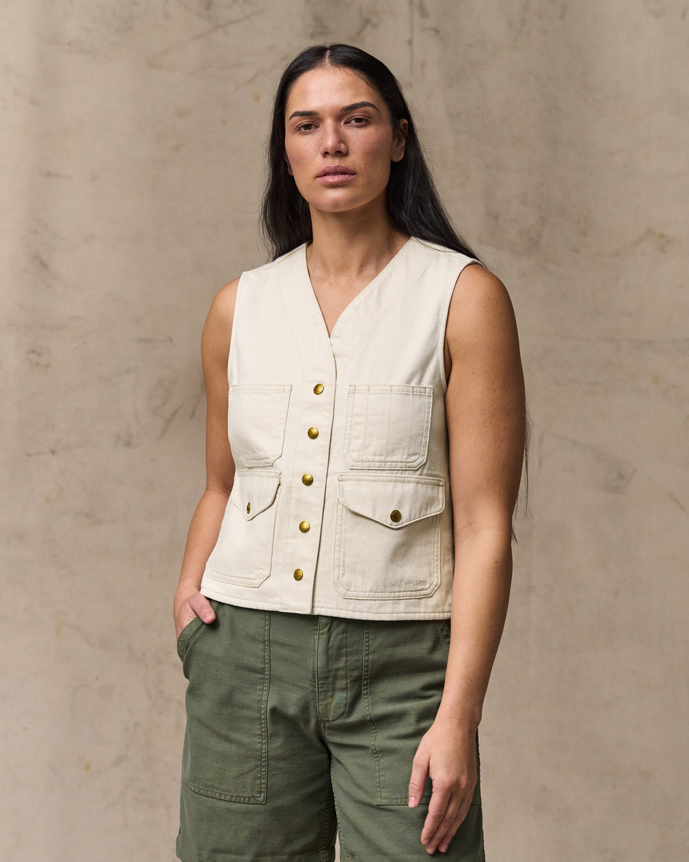 image of a model wearing Filson's Women's Archive Cruiser Vest - Natural Seed