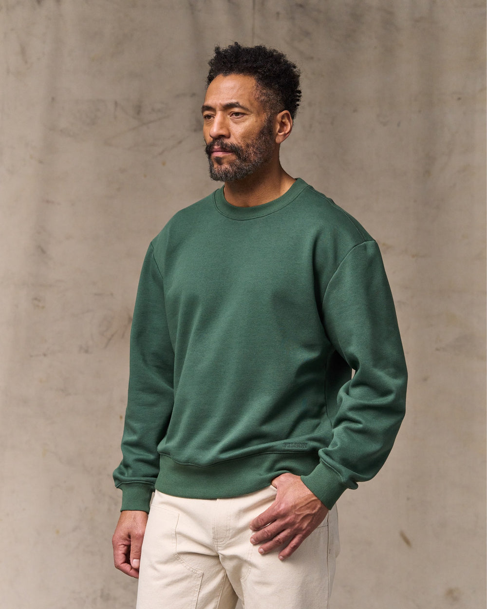 image of a model wearing Filson's Northwest Crewneck Sweatshirt - Granite Green