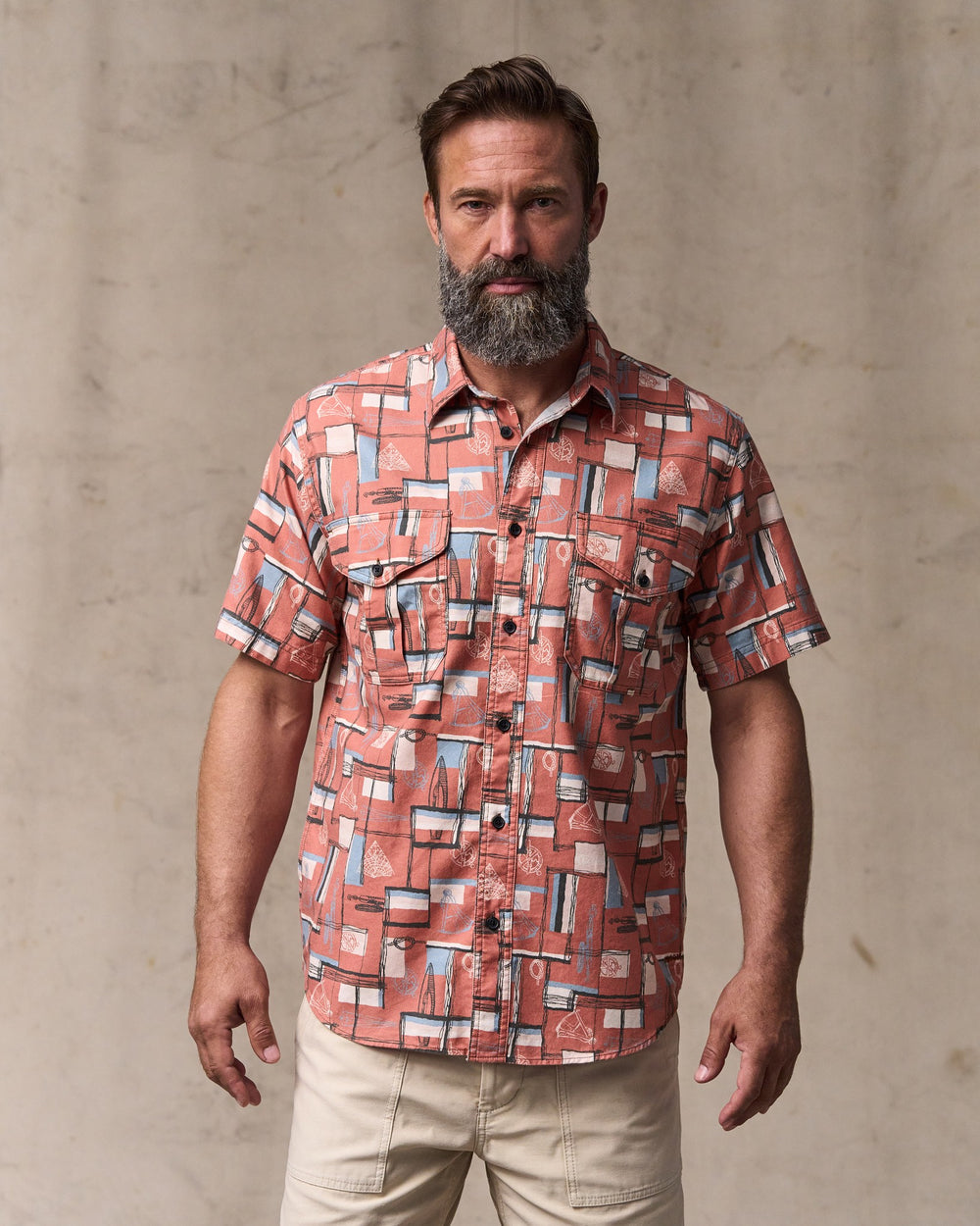 image of a model wearing Filson's Short Sleeve Lightweight Alaskan Guide Shirt  - Russet / Print