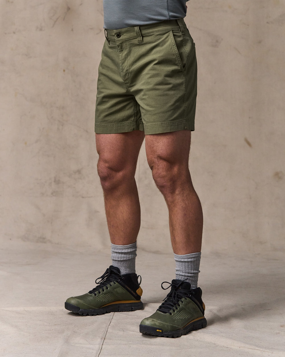 image of a model wearing Filson's Granite Mountain 6" Shorts - Burnt Olive
