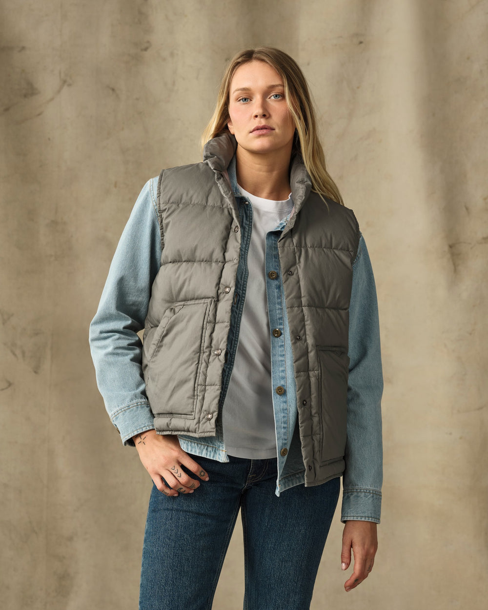 image of a model wearing Filson's Women's Heritage Cotton Down Vest - Smokey Olive