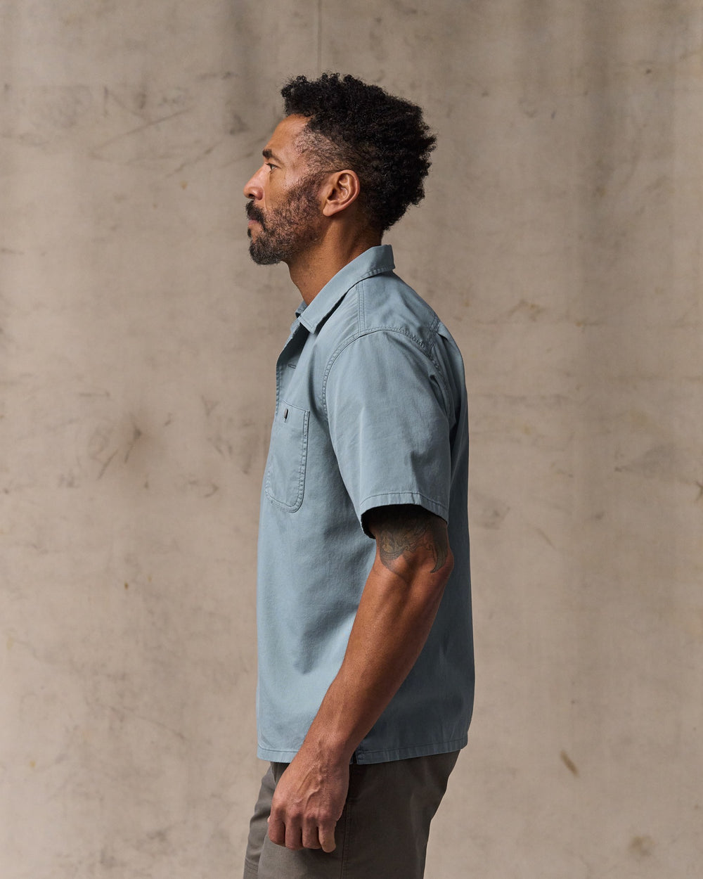 image of a model wearing Filson's Short Sleeve 4.5-oz. Twill Shirt - Lead
