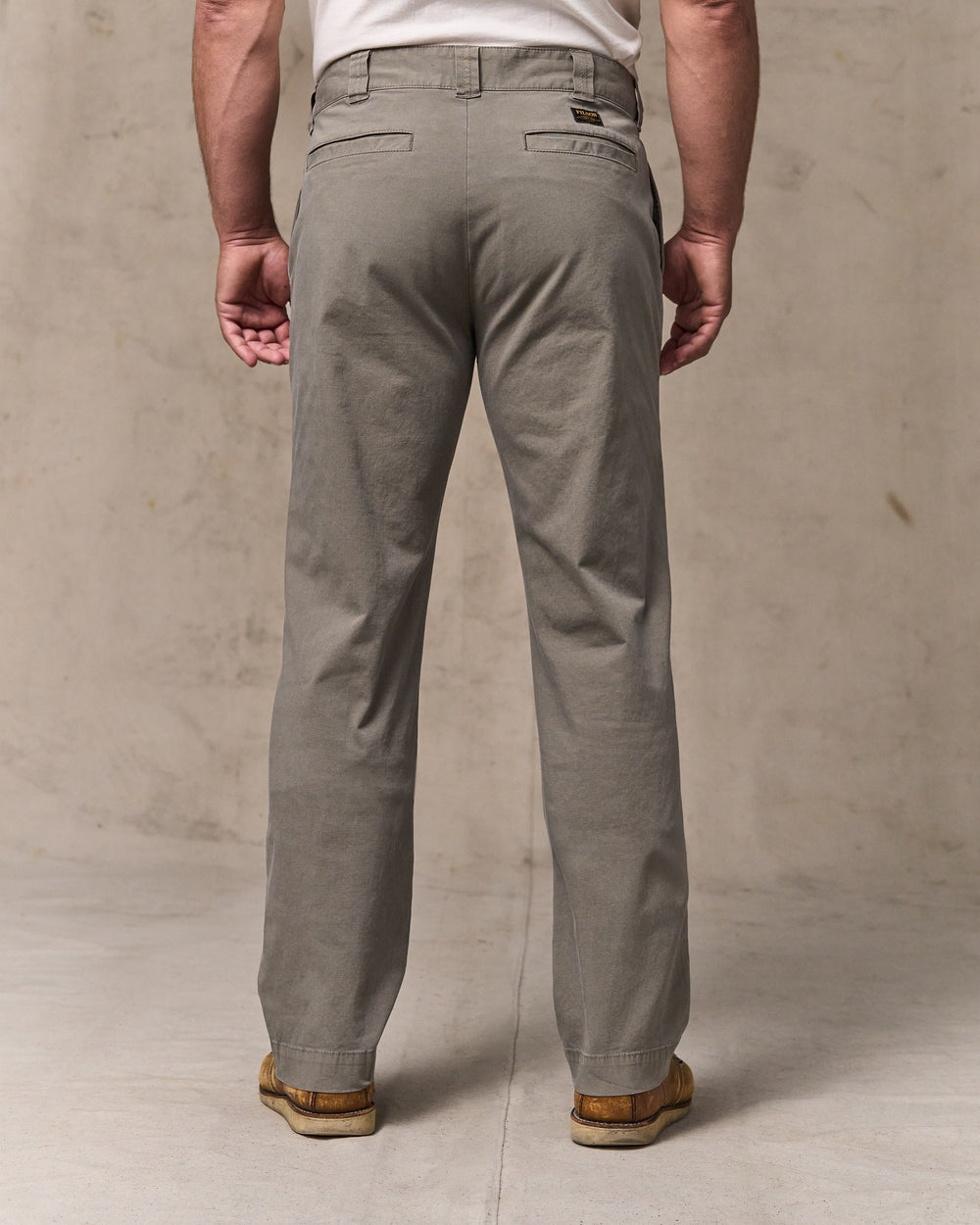 image of a model wearing Filson's Granite Mountain Flat Front Pants - Hawk Brown