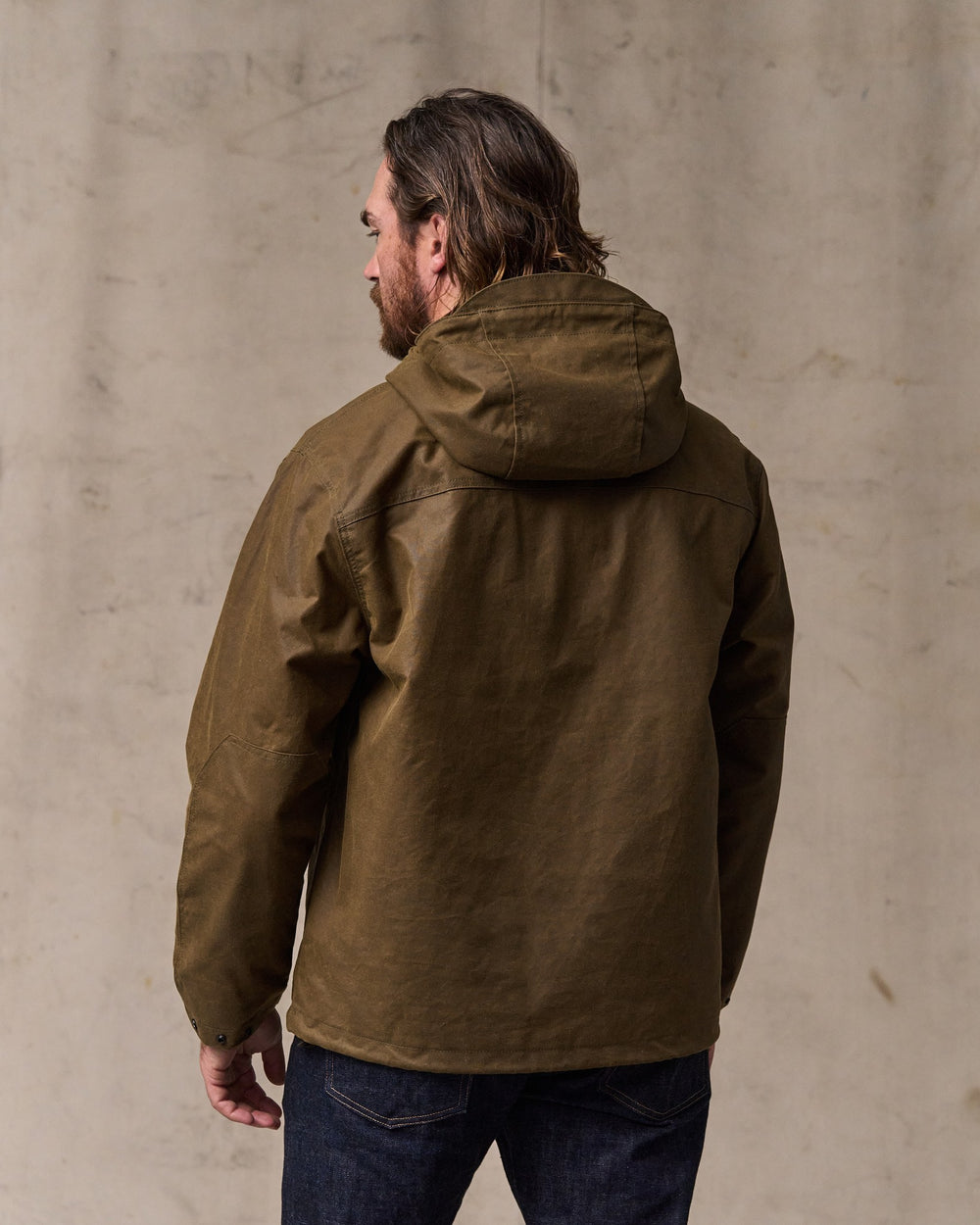 image of a model wearing Filson's Shelter Cloth Waxed Anorak - Dark Tan