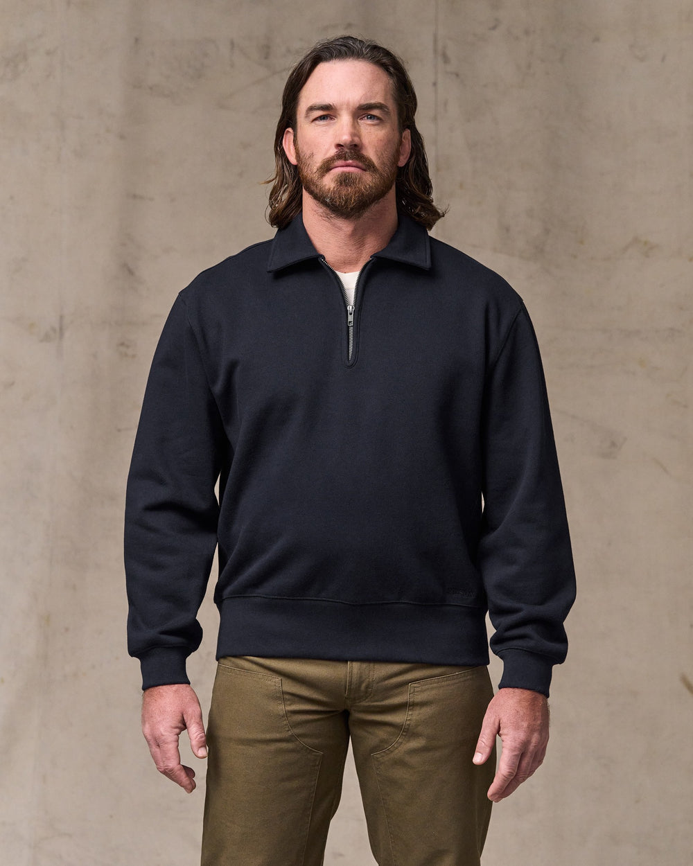 image of a model wearing Filson's 14-oz. Heritage Fleece Quarter Zip - Dark Indigo