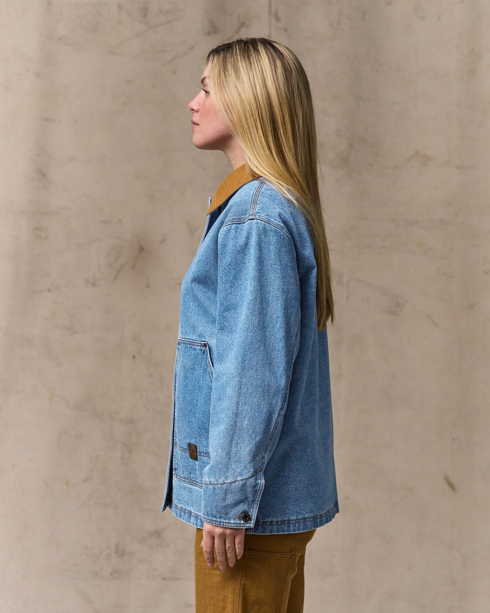 image of a model wearing Filson's Women's 11-oz. Denim Barn Coat - Light Indigo