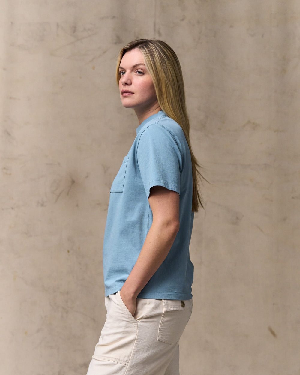image of a model wearing Filson's Women's Short Sleeve Pocket Tee - Light Blue