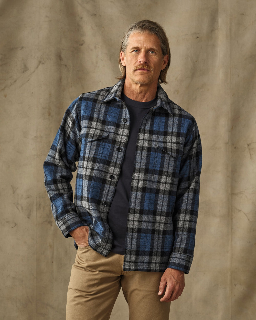 image of a model wearing Filson's Wool Jac-Shirt - Blue / Heather Gray Plaid