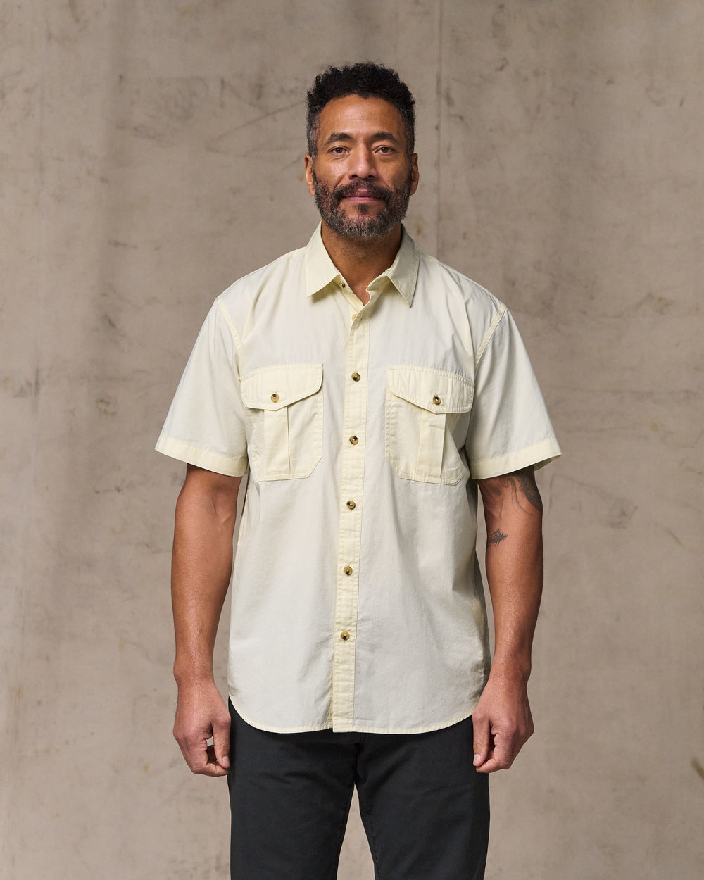 image of a model wearing Filson's Filson's Washed Short Sleeve Feather Cloth Shirt - Ivory