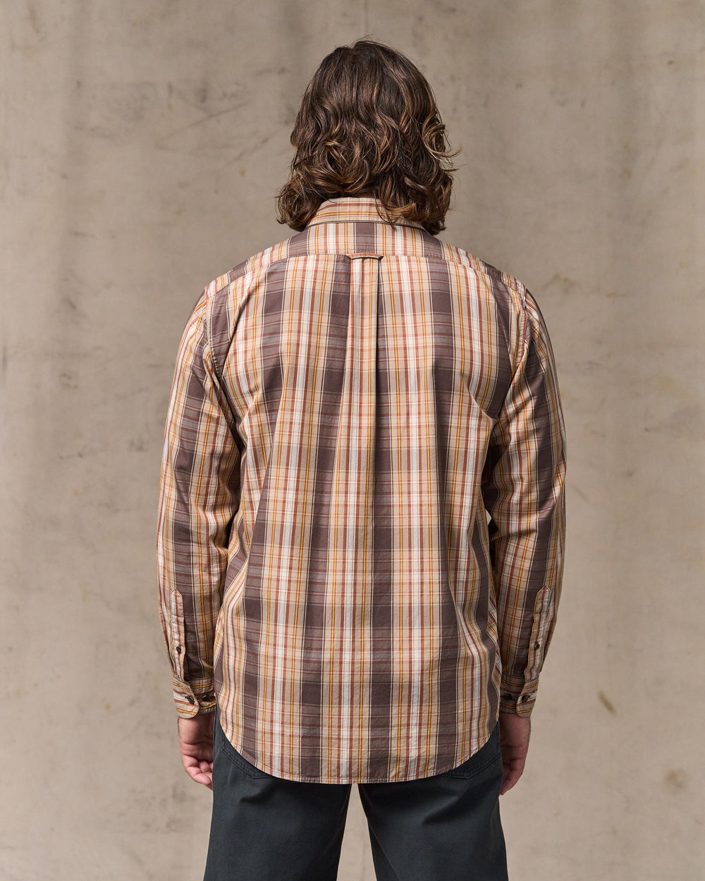 image of a model wearing Filson's Filson's Washed Feather Cloth Shirt - Brown Multi Plaid
