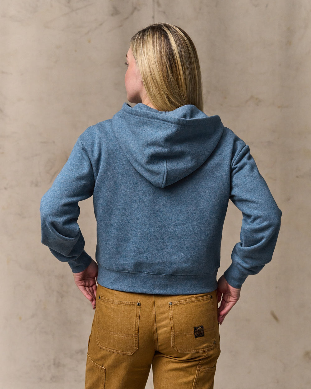 image of a model wearing Filson's Women's French Terry Half-zip Hoodie - Light Blue