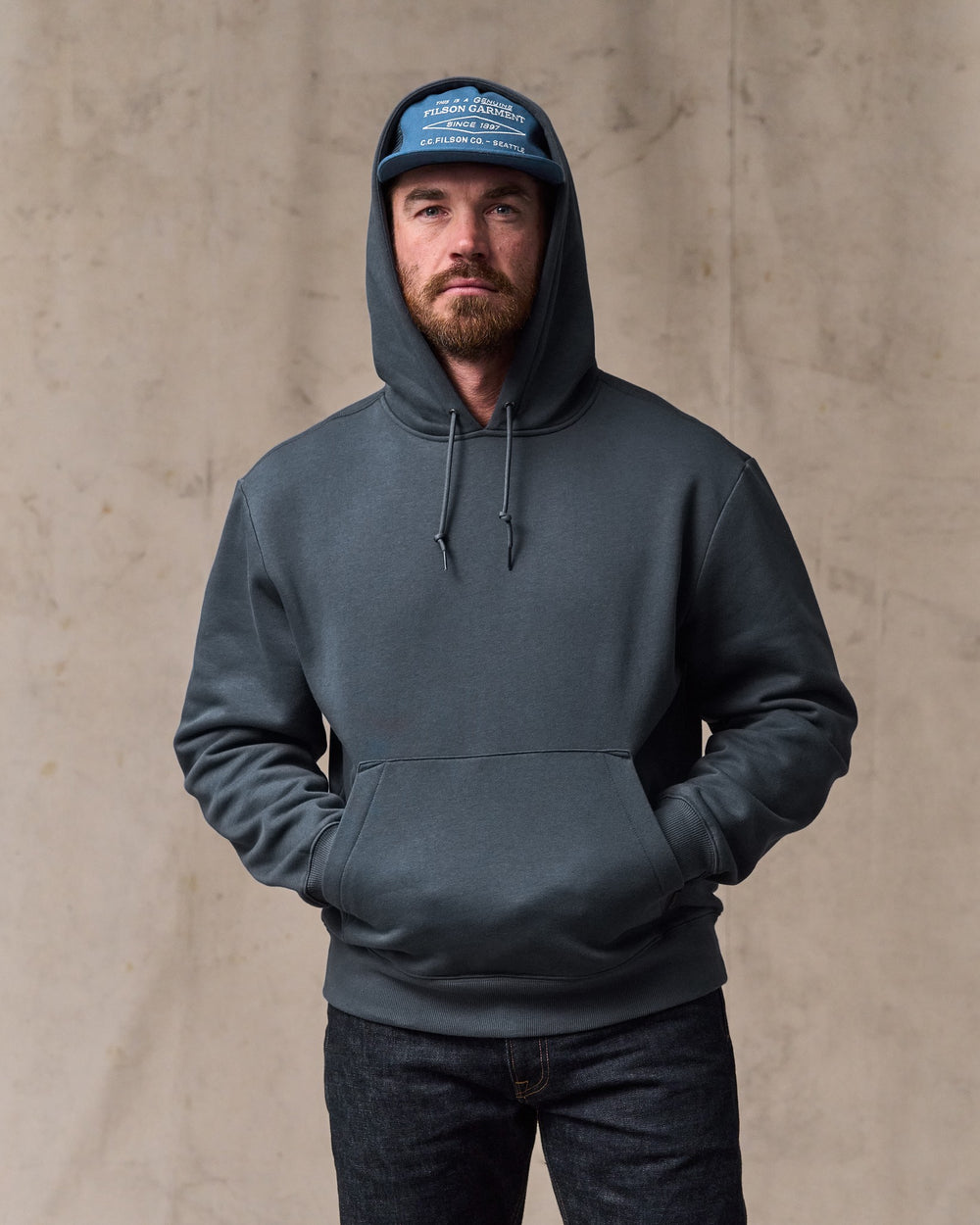 image of a model wearing Filson's Northwest Hoodie - Ink Blue