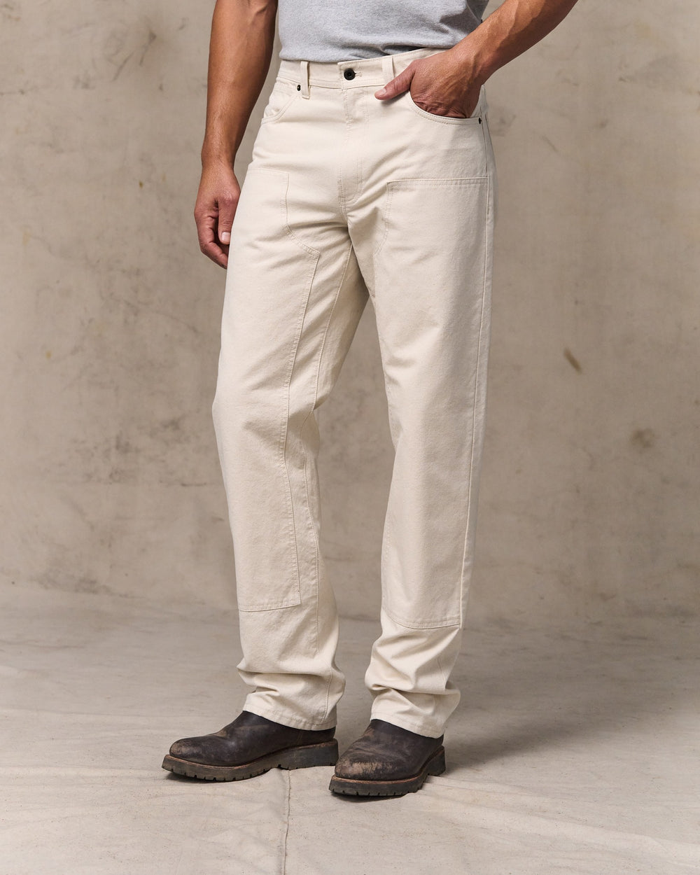 image of a model wearing Filson's Dry Tin Double Front Pants - Natural Seed