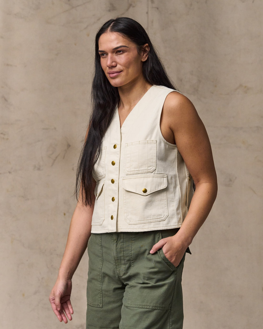 image of a model wearing Filson's Women's Archive Cruiser Vest - Natural Seed